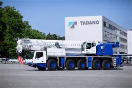 blue and white 5 axle Tadano all terrain crane model AC 5.250-2 in front of the factory