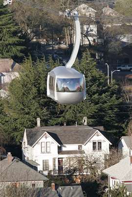 One of the two cars for the aerial tram in Portland, Ore., passes over a neighborhood January 31, 2007. 