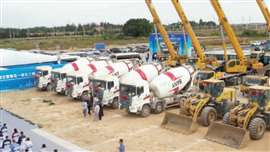 A row of cement mixers and other construction machinery as construction starts on a refining and petrochemical complex in Fujian, China