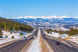 Colorado highway and Rocky Mountains (Image: Adobe Stock)